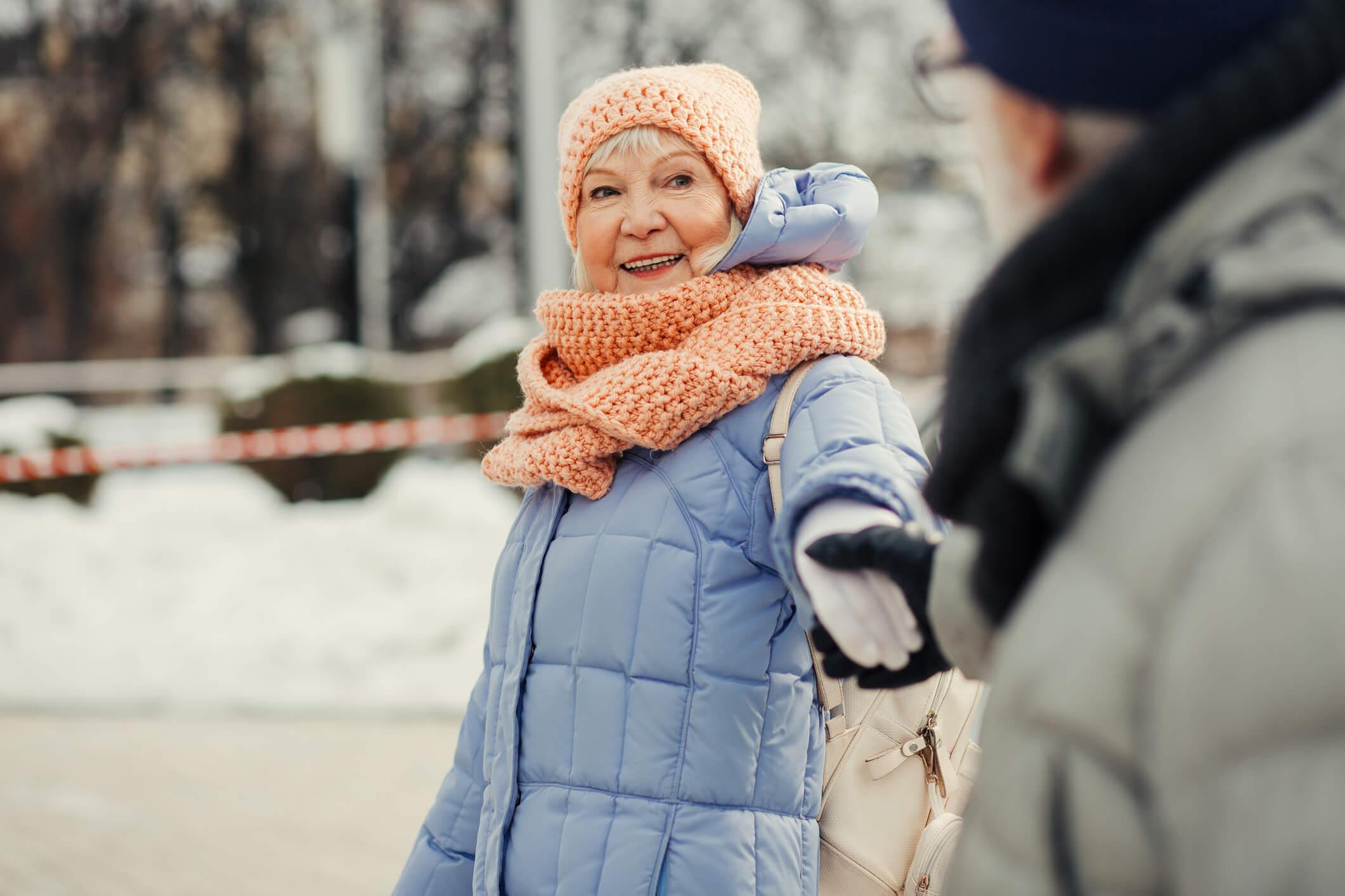 Older couple walking in the snow