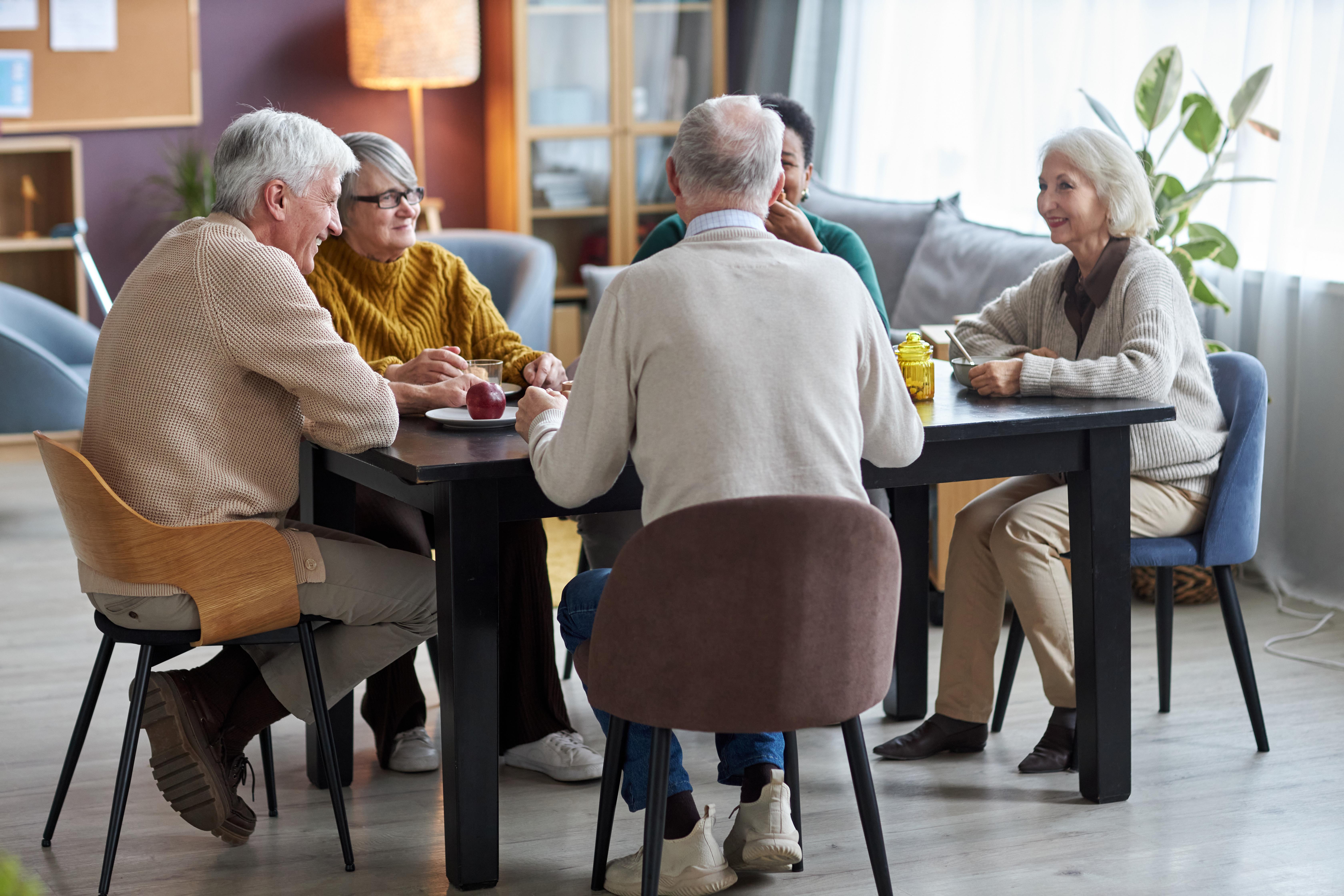 Group of people chatting over lunch