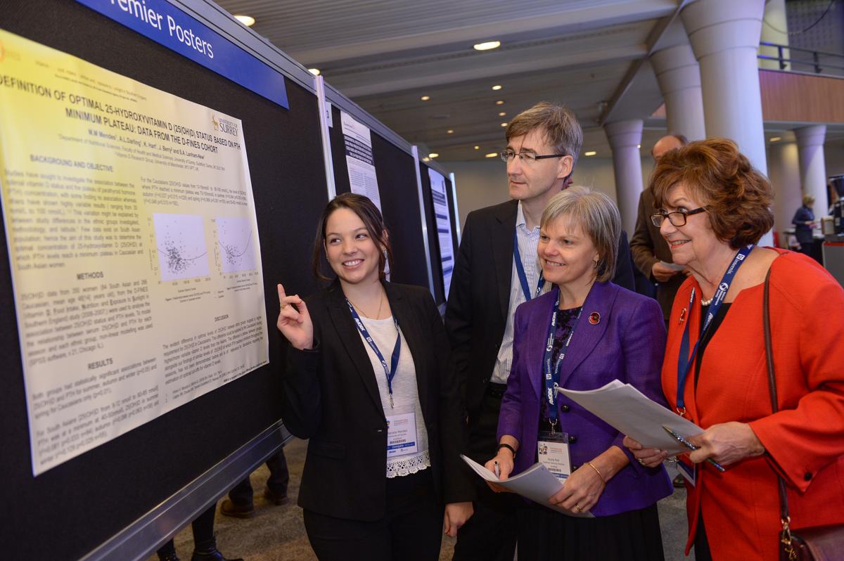 Researchers listening to a presentation at a conference