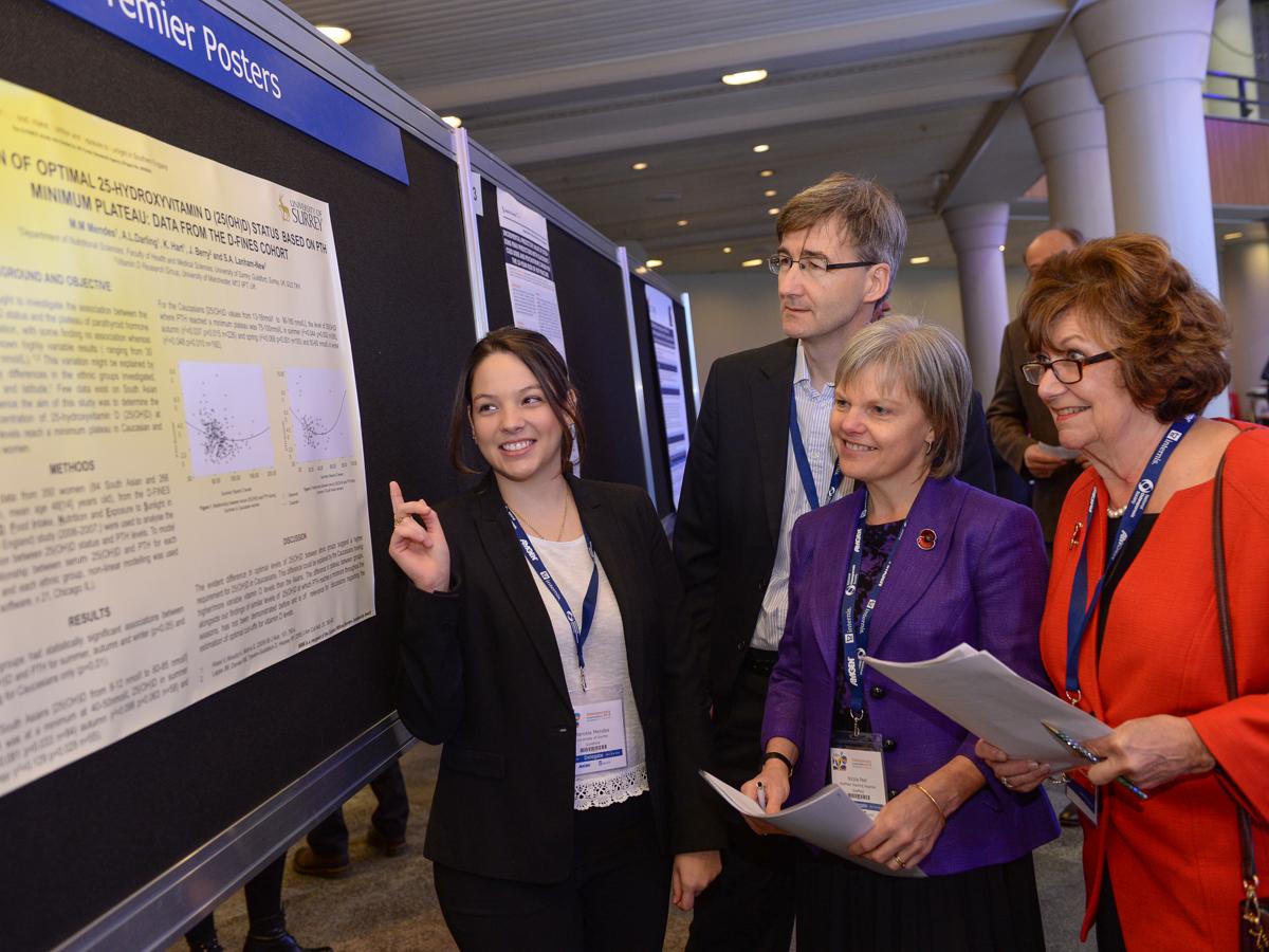 Researchers listening to a presentation at a conference