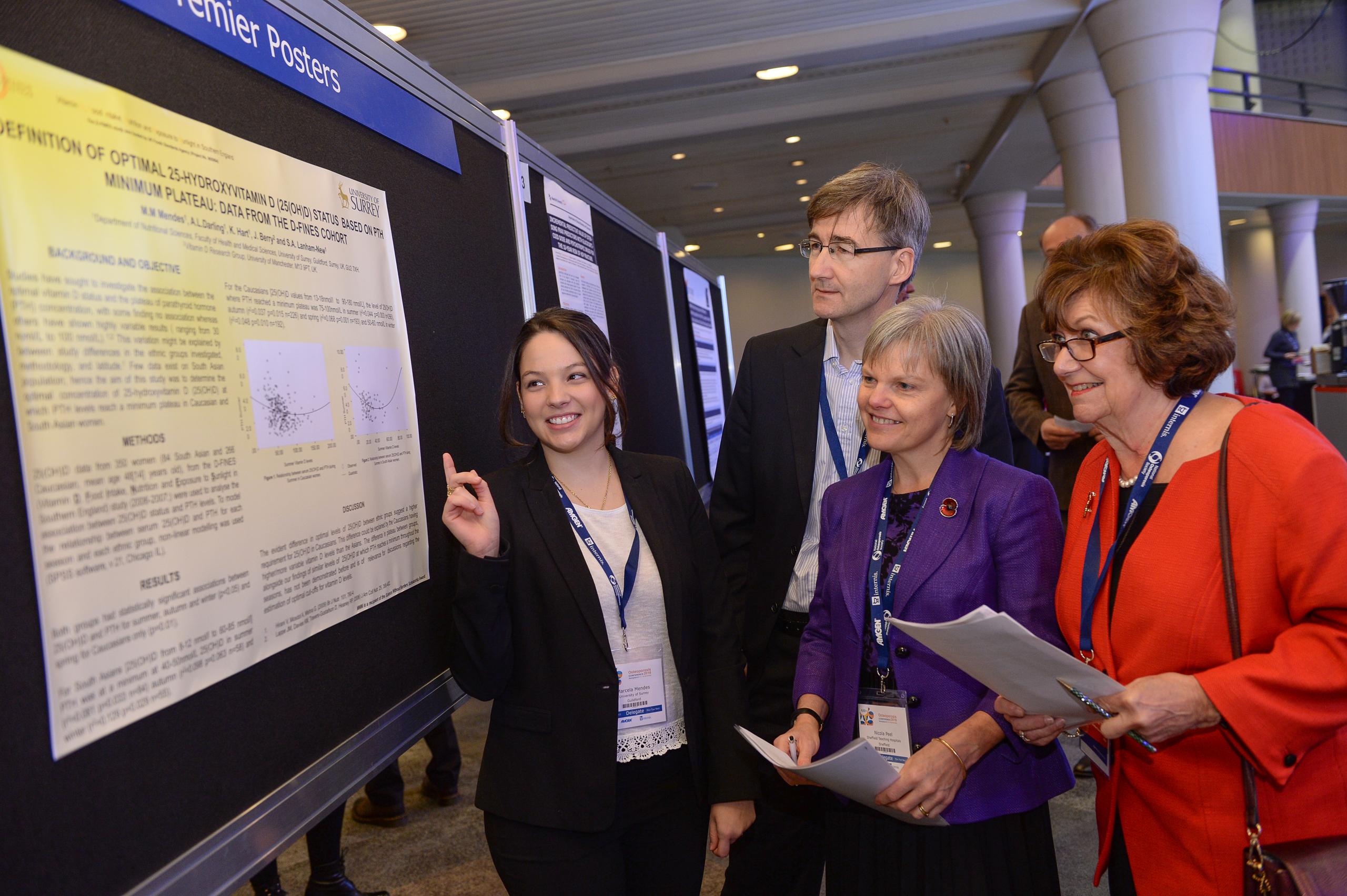 Researchers listening to a presentation at a conference