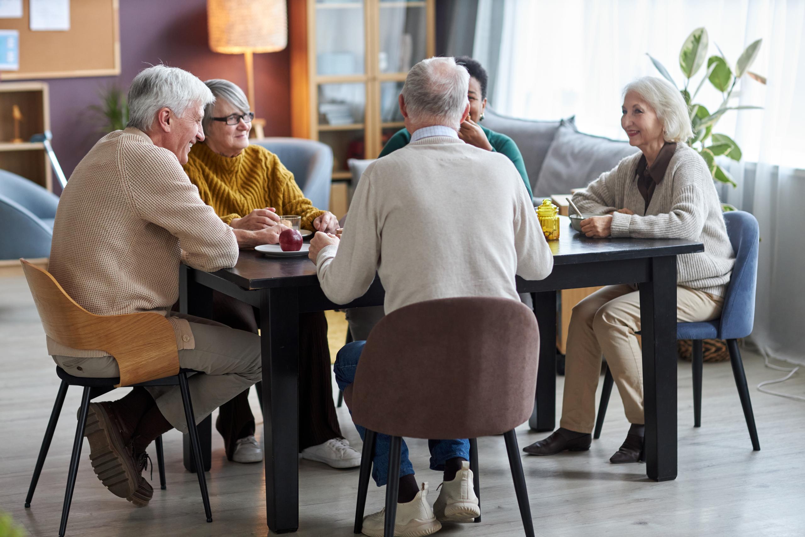 Group of people chatting over lunch
